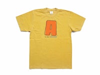a yellow t - shirt with the letter a on it